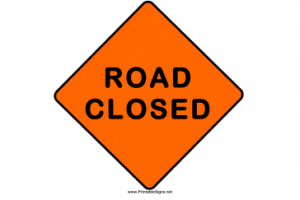 Orange diamond road sign with the words "ROAD CLOSED."